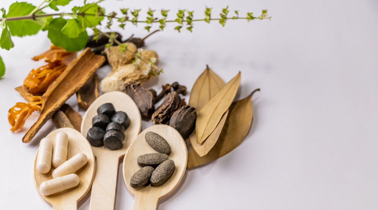 Table adorned with an assortment of potent herbs and medicines, symbolizing a holistic approach to natural remedies for ED and way to overcome erectile dysfunction.